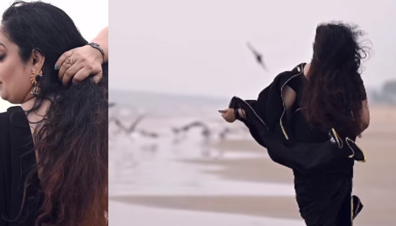 actress reshmi soman viral beach photo shoot in black saree viral vvk