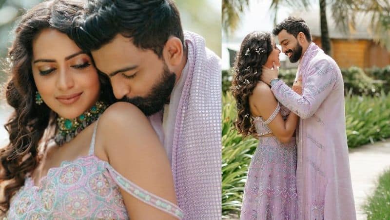 Actress Amala Paul shines in lavender coloure lehenga in her special day she married businessman Jagat desai in Kerala here is wedding photos akb