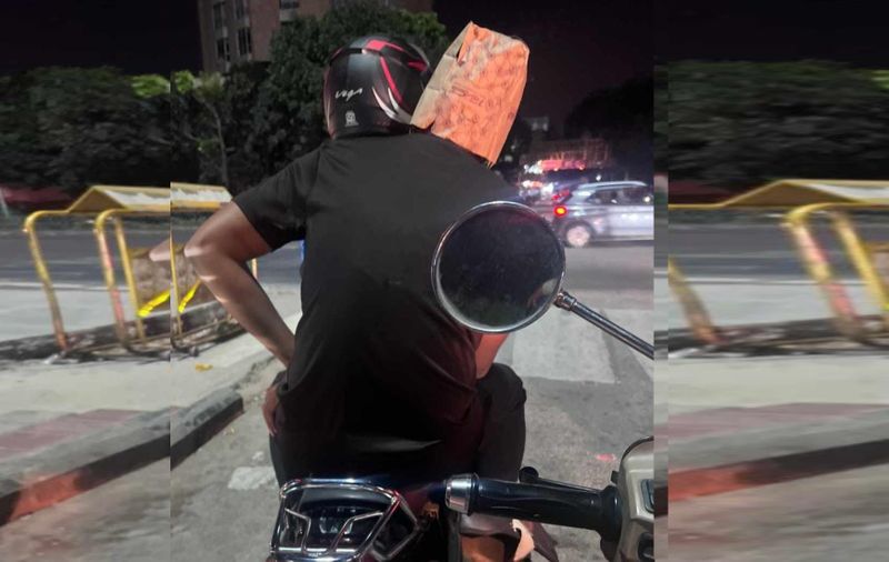 Bengaluru pillion bike rider use paper bag as helmet Resident react with testing Police AI camera ckm