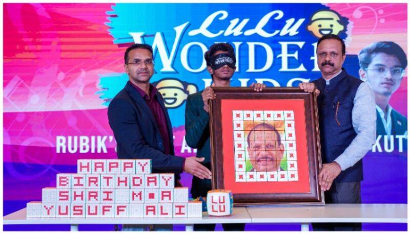 Affan kutty creates a birthday gift to MA Yusuff Ali within minutes arranging Rubiks Cube as his photo afe