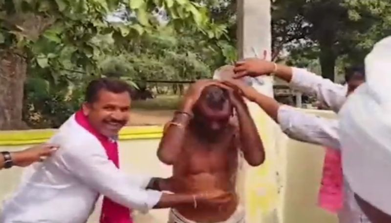 Telangana Polls 2023 BRS workers bathe elderly man in a poll stunt video goes viral ksm