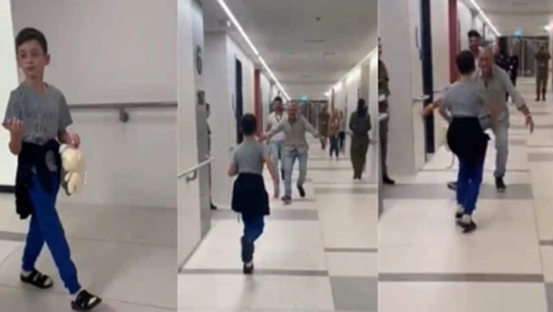 Israeli boy held hostage by Hamas runs to reunite with family smp