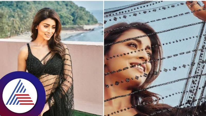 actress shriya saran looks gorgeous in black transparent saree gvd