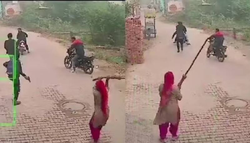 woman attacking men with gun with a broomstick rlp