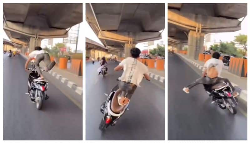 video of a young man falling down while stunting on a busy road is going viral bkg 