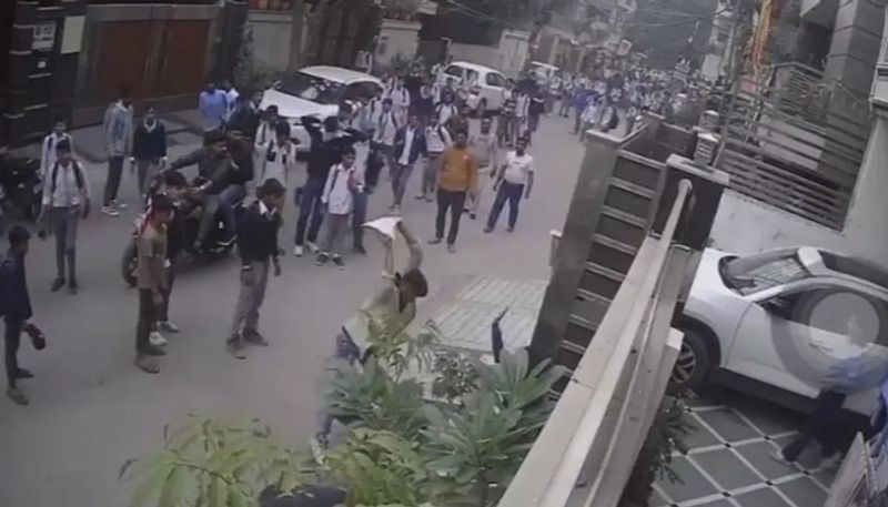 CCTV footage  Viral Delhi Man Beaten With Stones Tiles And Knife As Children Watch san