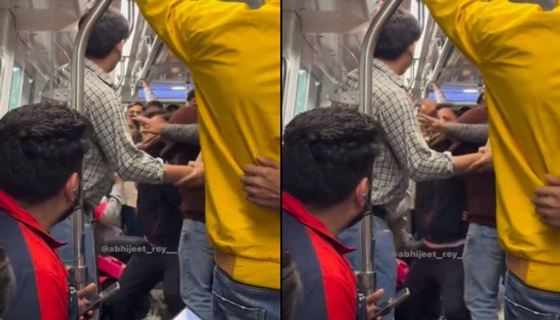 viral video two men fighting in delhi metro for seat rlp