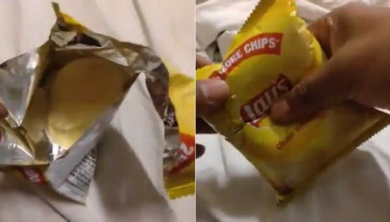 customer showing only two chips that he got in a lays packet