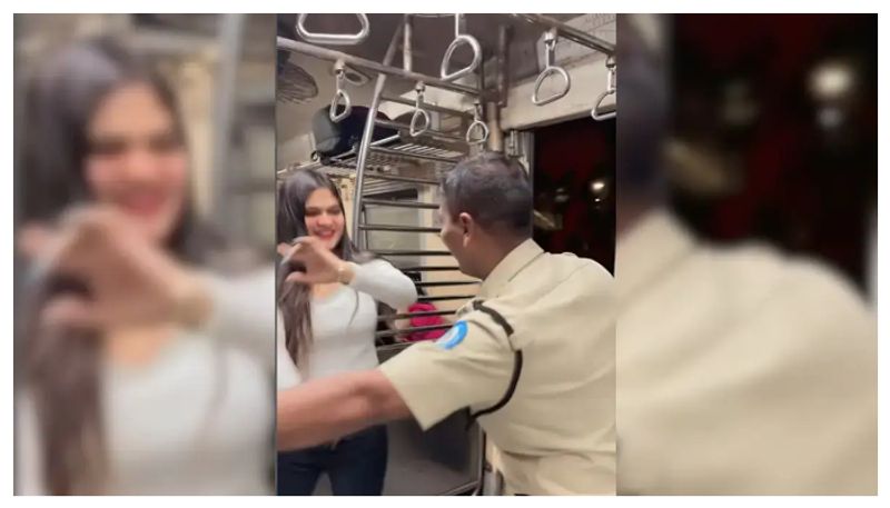 Police officer dance with lady in Train goes viral, Authority take action prm 