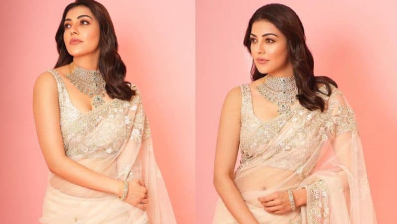 Indian 2 movie actress Kajal agarwal dazzling photoshoot in transparent saree gan