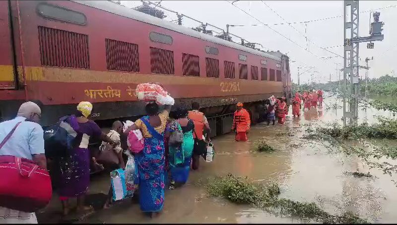 Passengers rescued at Srivaikuntam railway station are arranged to go to Chennai sgb