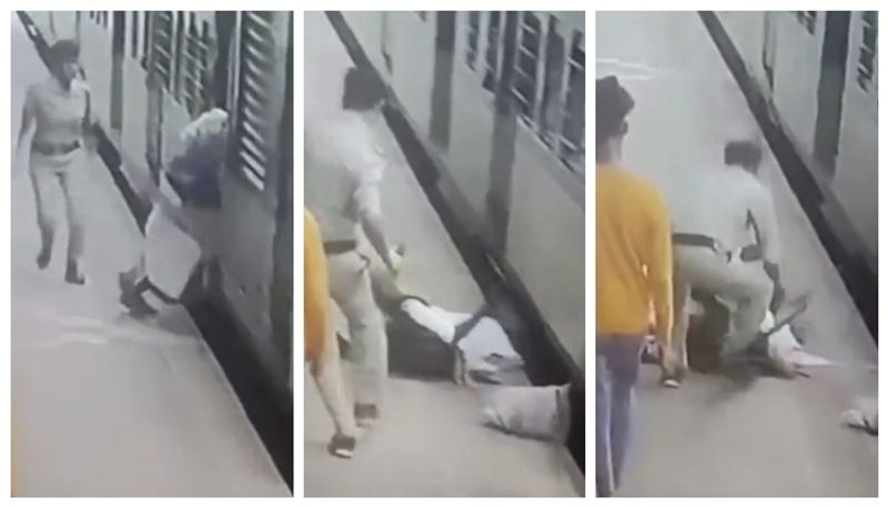 rpf constable saves a women from getting crushed under train in mumbai bkg