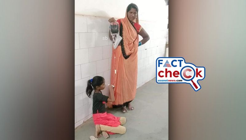 Woman holds blood bag for transfusion as daughter sits on hospital floor not in Gujarat fact check jje 