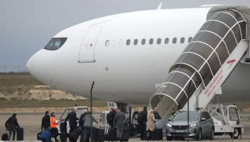 plane held in France with indians lands back in mumbai full details ans