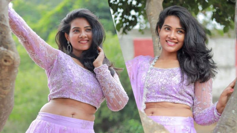 Dhivya Duraisamy latest hip showing trending photoshoot in lavender lehenga gan