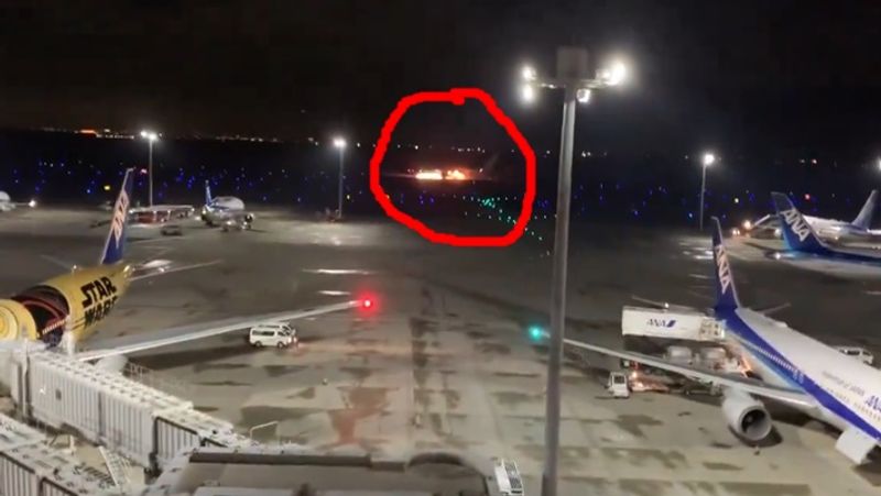 Japan Airlines plane in flames on the runway at Tokyo Haneda Airport smp