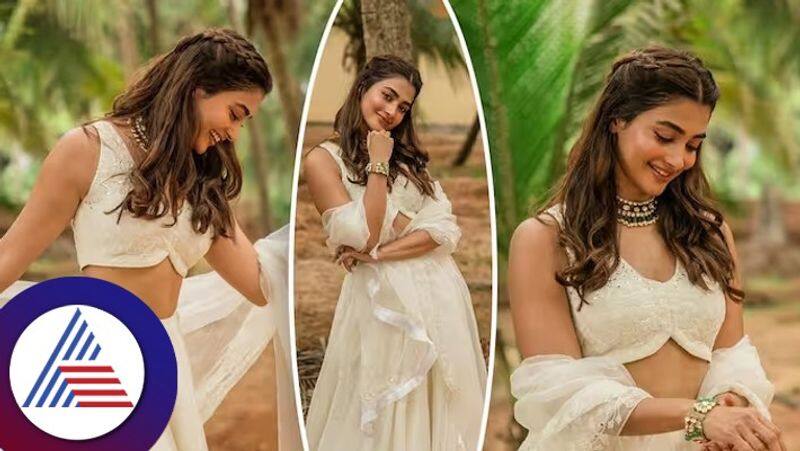 south indian actress pooja hegde in off white lehenga in coconut tree garden see beautiful photos gvd