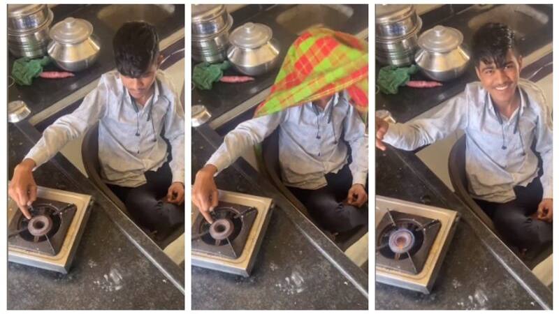 boy lighting gas stove using his finger