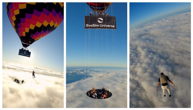 skydivers hit the ball on the trampoline attached to the hot balloon before the big jump bkg