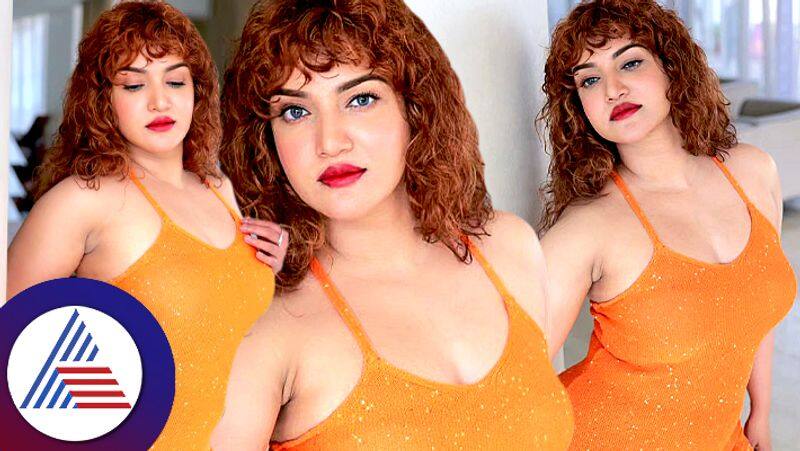 Malayalam Actress Honey Rose in orange dress, Weird hairstyle fans comment as modern Shakeela Vin