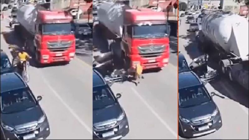 Bike rider fell under the lorry after car occupants opened door without looking back viral video akb