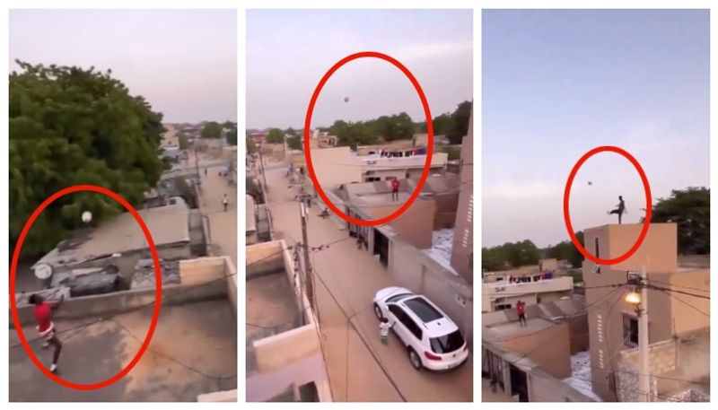 video of young men playing football from the top of houses in different parts of the street has gone viral bkg