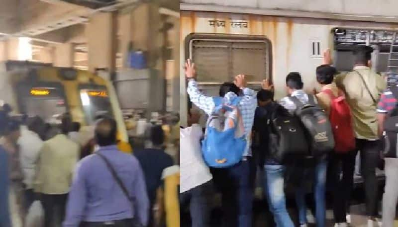 Mumbai commuters push train coach to save man video rlp