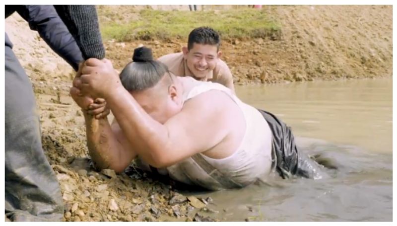 video of Nagaland minister Temjen Imna struggling to get down to a pond has gone viral on social media bkg 