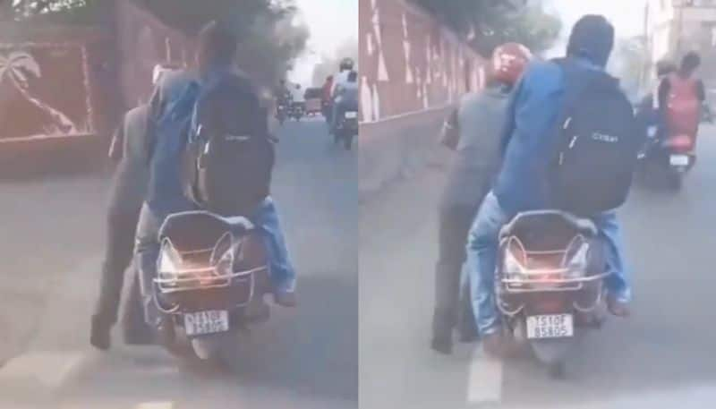 rapido driver captain pushes bike with customer on it after he refused to kms