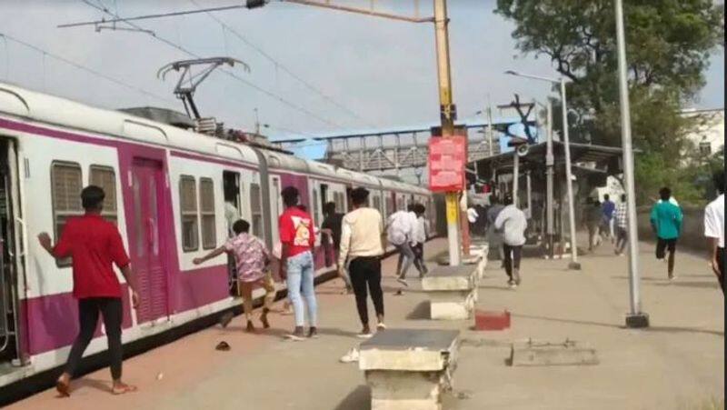 At the Chennai train station, students from two city colleges fight, throw stones, and three held-rag