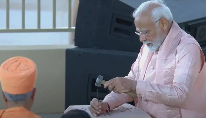 PM Modi inscribes 'Vasudhaiv Kutumbakam' on stone using hammer, chisel at BAPS Mandir
