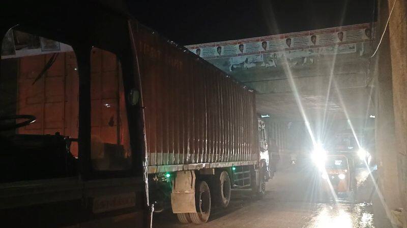 heavy trafficjam while container lorry stuck under subway in kovilpatti vel