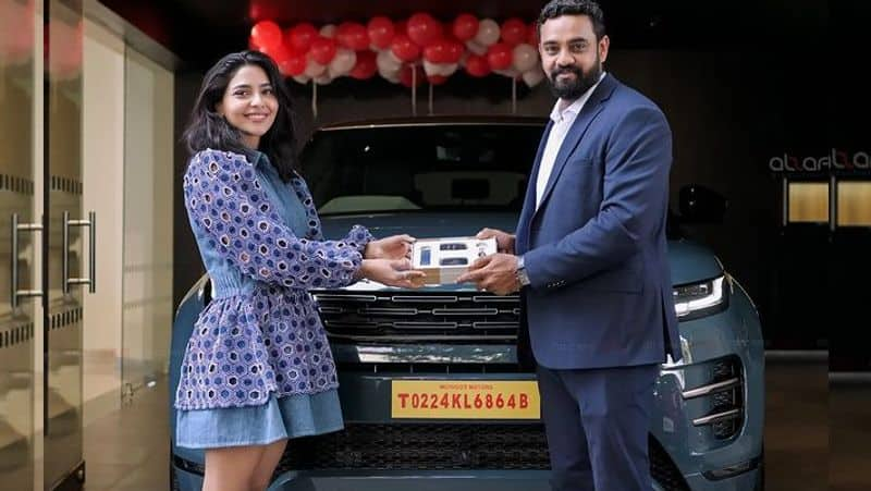 Thug Life Actress Aishwarya Lekshmi buys a brand new range rover Evoque 2024 car gan