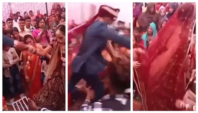 Groom Tries To Help Bride Get On Stage but bride not interest in that marriage video shows it bkg