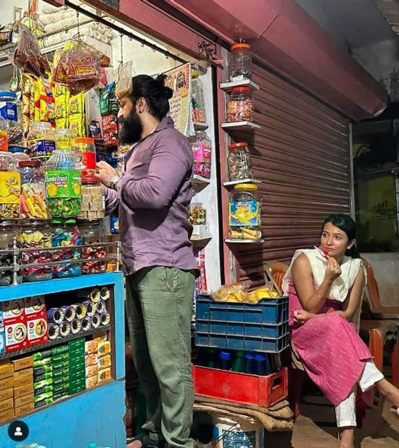 Yash shops in roadside shop for his family nbn