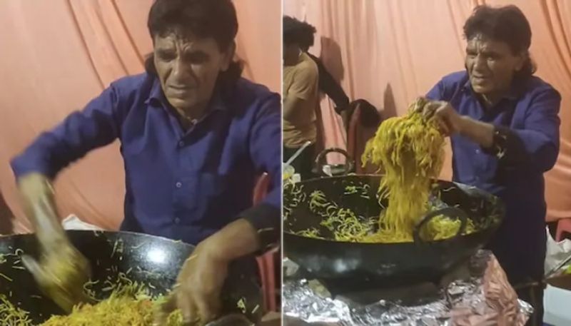 man using bare hands to mix noodles the video going viral