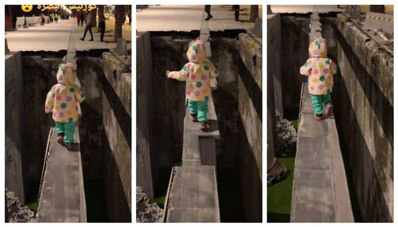 video of a little girl running through a narrow ledge will scare you bkg  