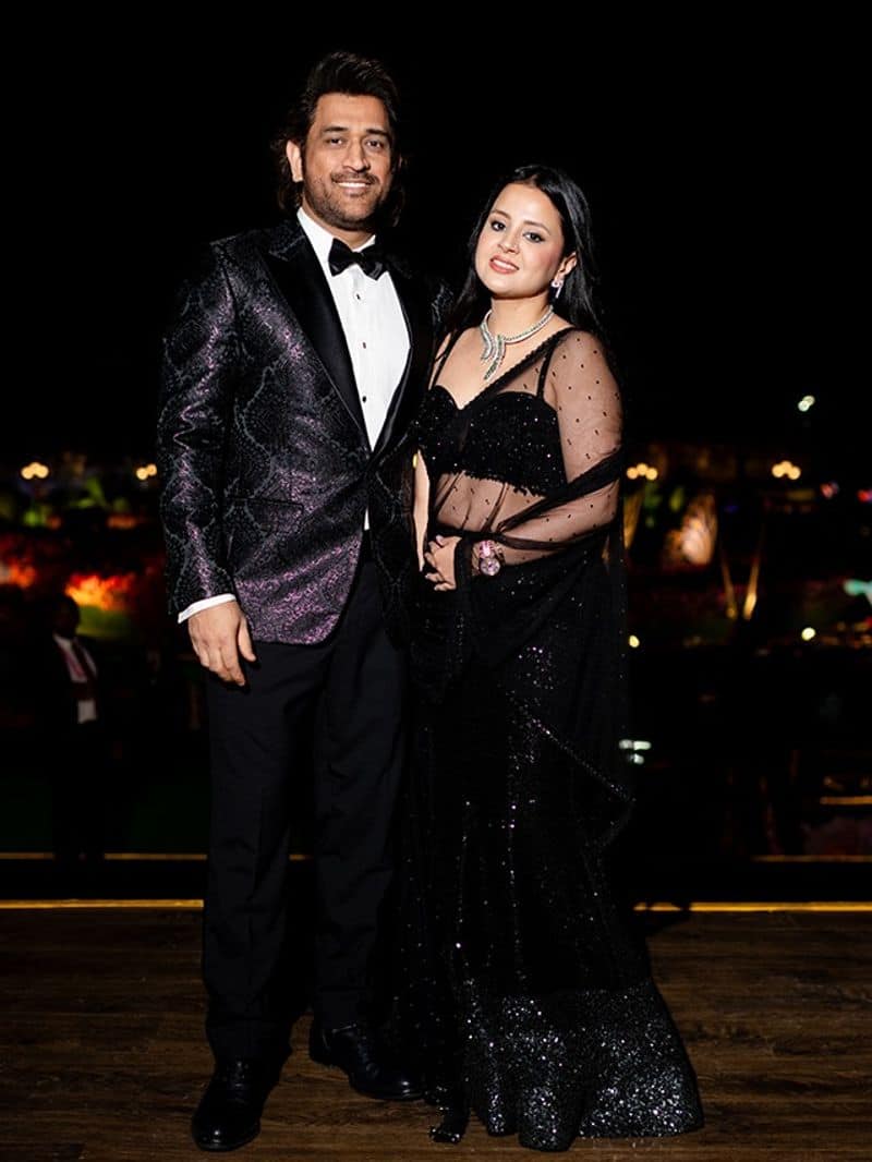 MS Dhoni and Sakshi are pose with a black and black costume look during the Pre Wedding of Anant Ambani and Radhika Merchant rsk