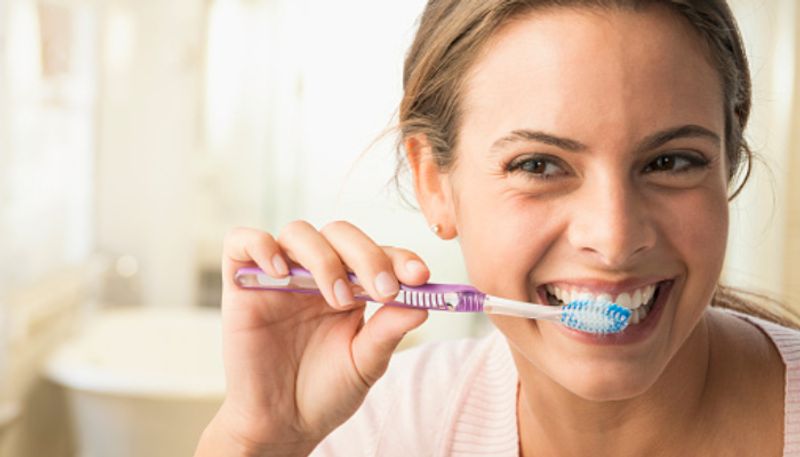 What are the health risks of not brushing your teeth regularly? Expert