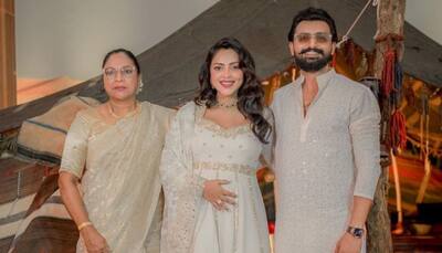'Aadujeevitham': Amala Paul stuns in elegant white dress, flaunts baby bump at film's music launch
