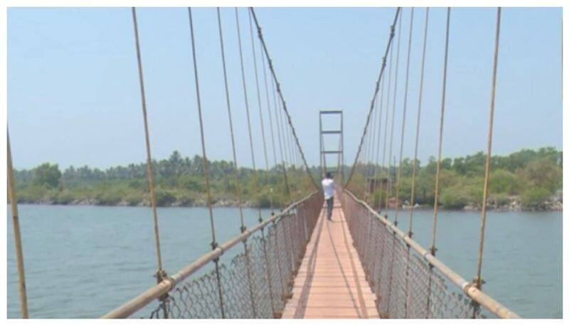 people walking on the broken Badagani river bridge nbn