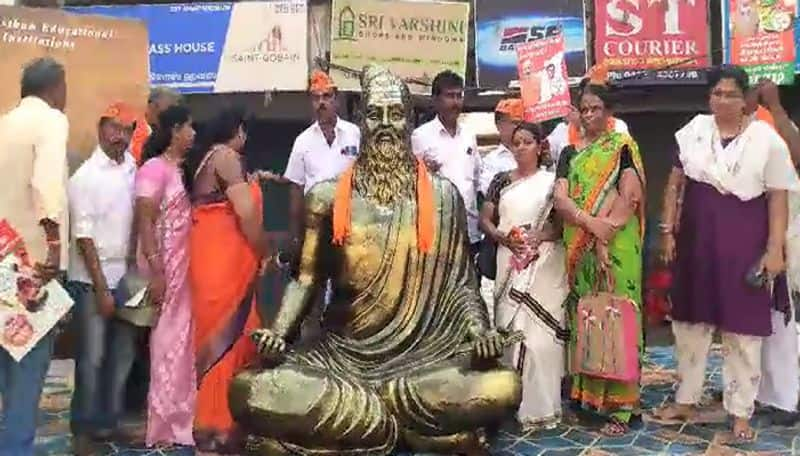 PM road show in coimbatore Bjp workers put saffron shawl for thiruvalluvar ans 