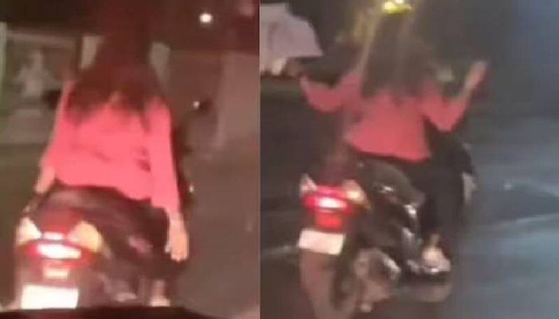 woman rides scooty hands free watch video rlp