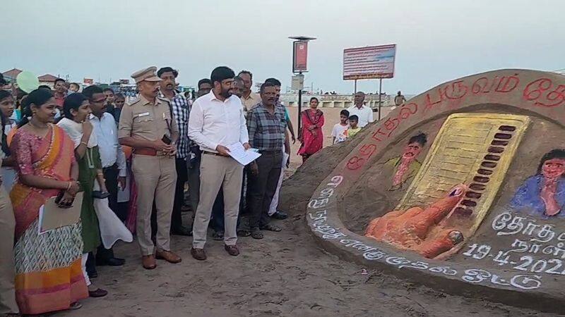 Awareness sand sculpture at Cuddalore Silver Beach emphasizing 100 percent voter turnout vel