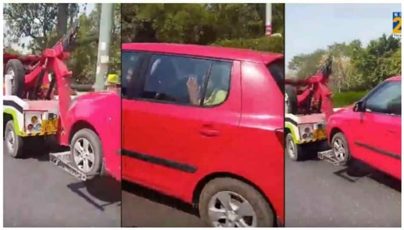 Car towed away illegally with two senior citizens sitting inside at Noida