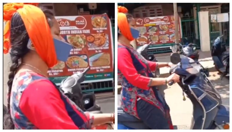 video of a Bengaluru Woman with using phone on Scooter ride went viral bkg