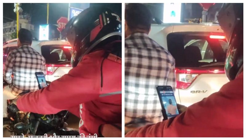 Video of Zomato delivery agent studying for exam at traffic signal goes viral bkg