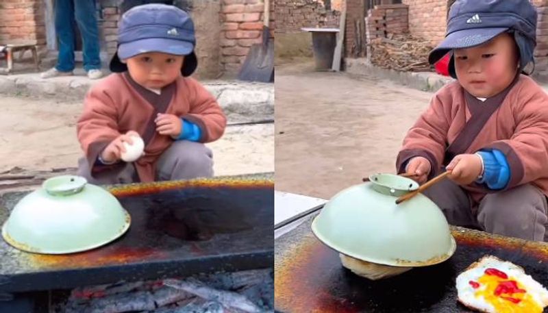 little boy making egg sandwich video 