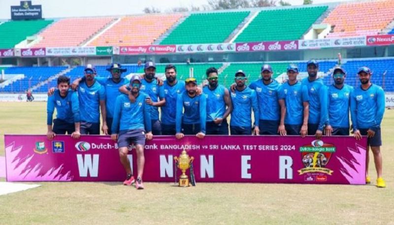 Sri Lankan players collect trophy in practice kits after whitewashing Bangladesh san