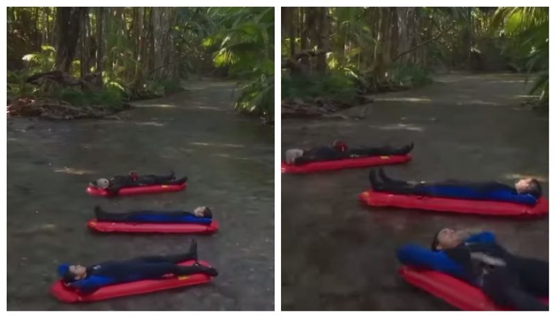 Video of people floating in sleeping bed through stream goes viral